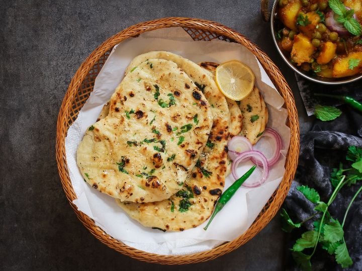A basket of assorted Indian flatbreads, including naan, from Lakeview Indian Restaurant in Bella Vista Indian Restaurants.